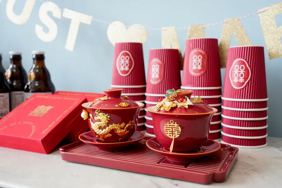 Double-happiness tea cups and red gift boxes set for a Chinese wedding tea ceremony